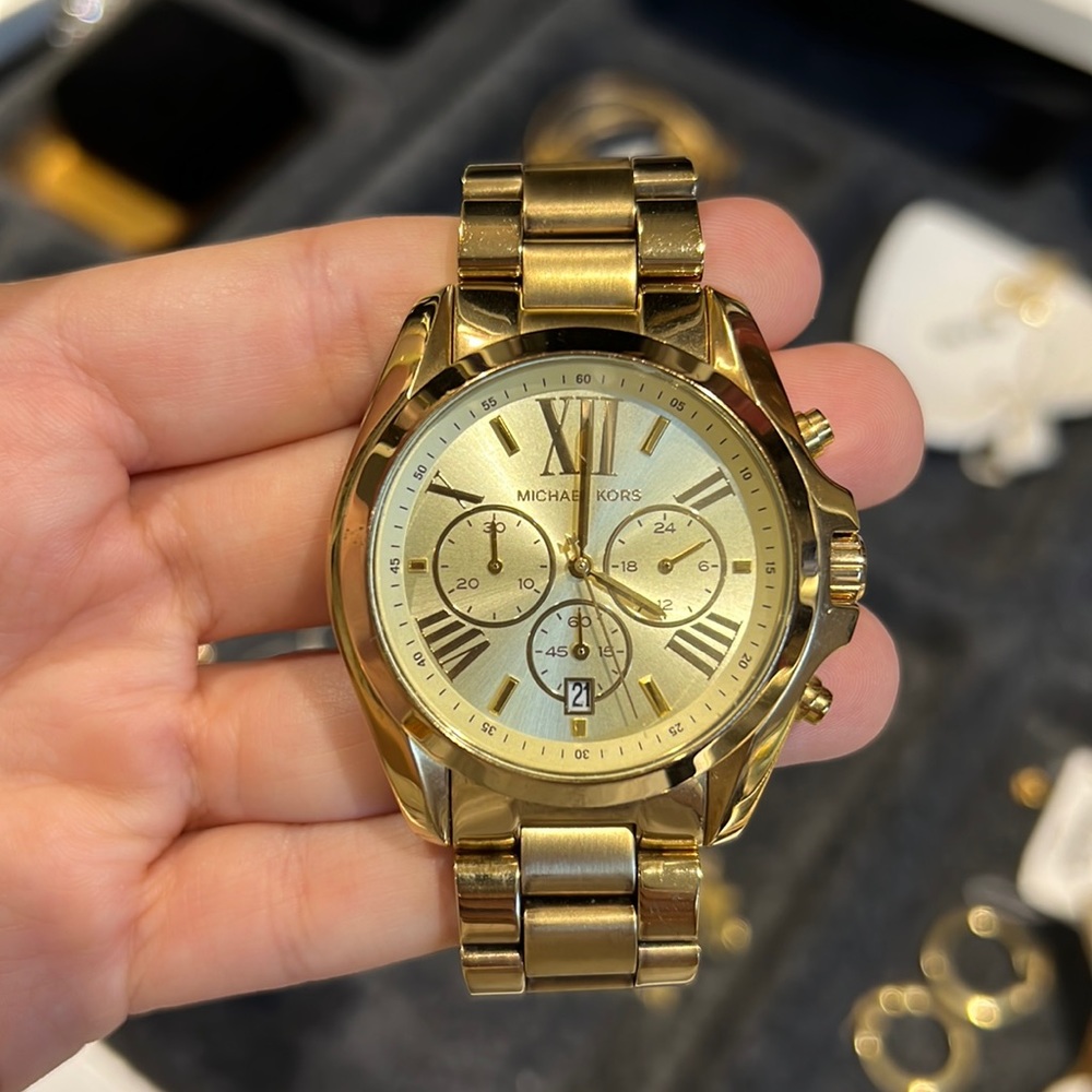 Large faced gold Michael Kors woman’s watch